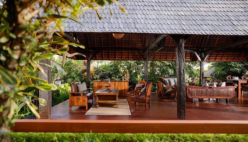 Beautiful semi-outdoor villa lobby features traditional wooden joglo style architecture and comfortable seating at Leona Valley View 1BR