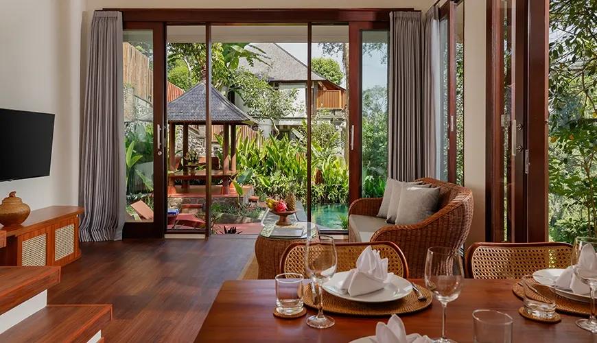 Bright living space with sliding glass doors opening to a tranquil outdoor patio and traditional gazebo at Leona Valley View 2BR