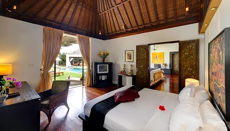 Spacious Bali bedroom with garden pool at Majapahit Villa Nataraj