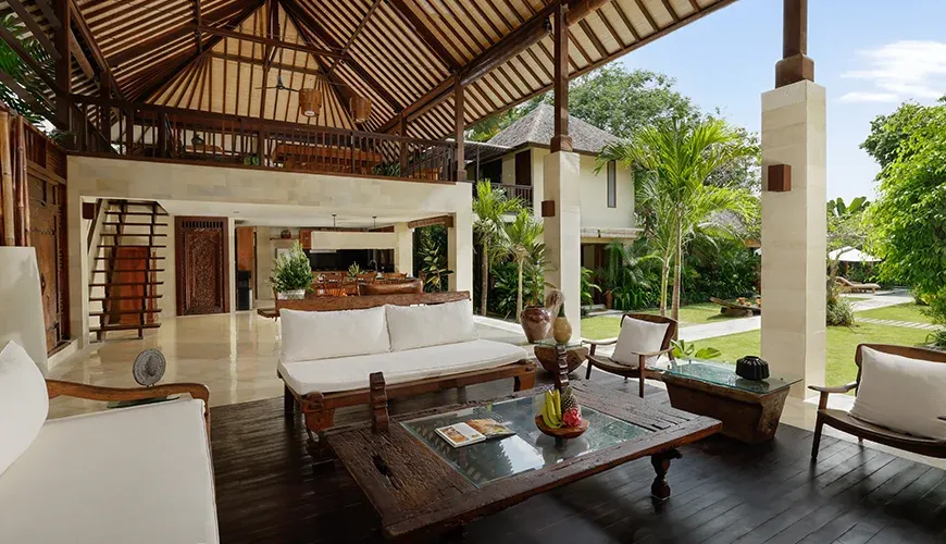Open air Balinese living area with garden view at Nelayan Villa