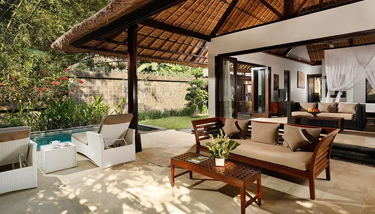 Bedroom patio features a private plunge pool and inviting lounge seating at Omecure