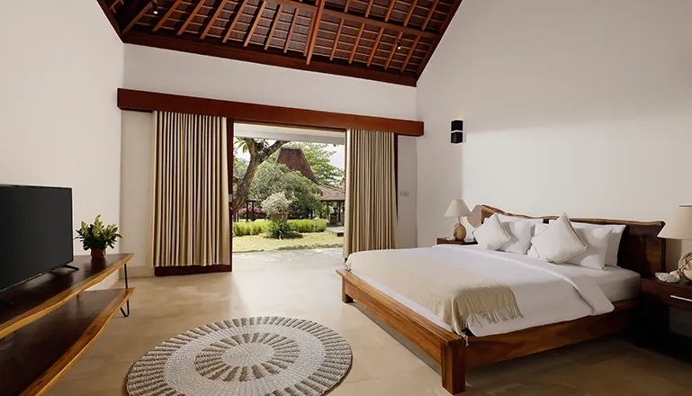 Beautiful bedroom with a minimalist aesthetic and a view at Omegia Canggu