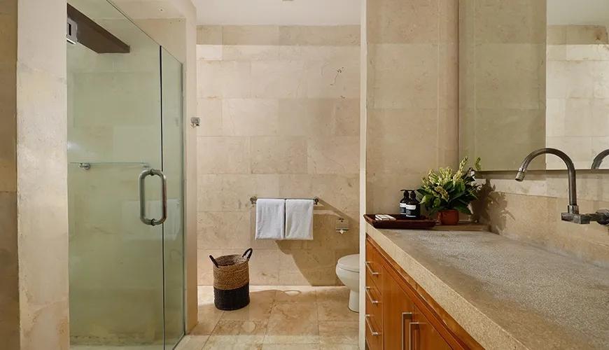 Contemporary bathroom with a clear glass shower enclosure at Omegia Canggu