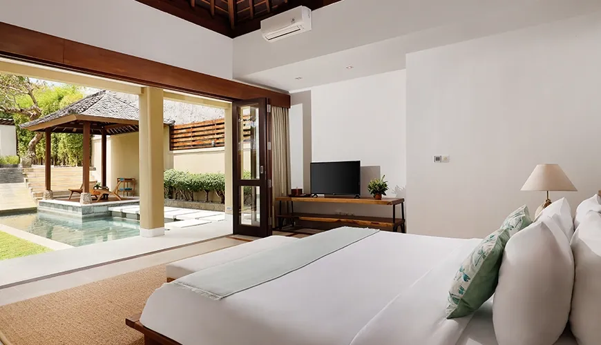 Elegant master bedroom with a view to the pool at Omegia Canggu