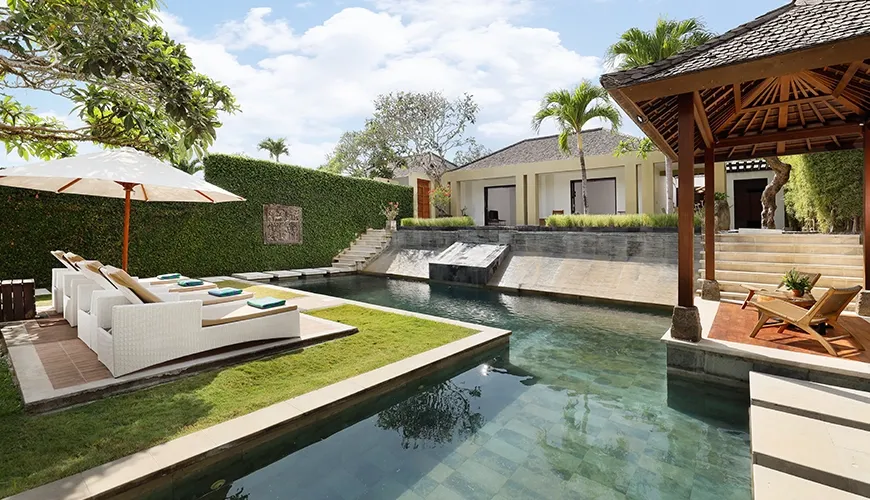 Inviting pool deck with comfortable seating and open views at Omegia Canggu