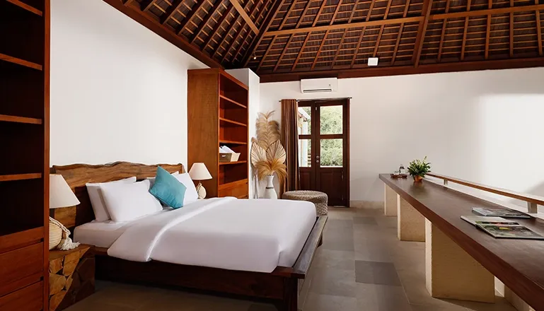 Luxurious villa bedroom with a king bed and subtle accents at Omegia Canggu