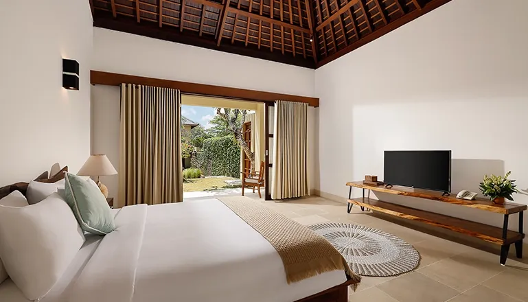 Relaxing bedroom with a large bed and subtle patterns at Omegia Canggu