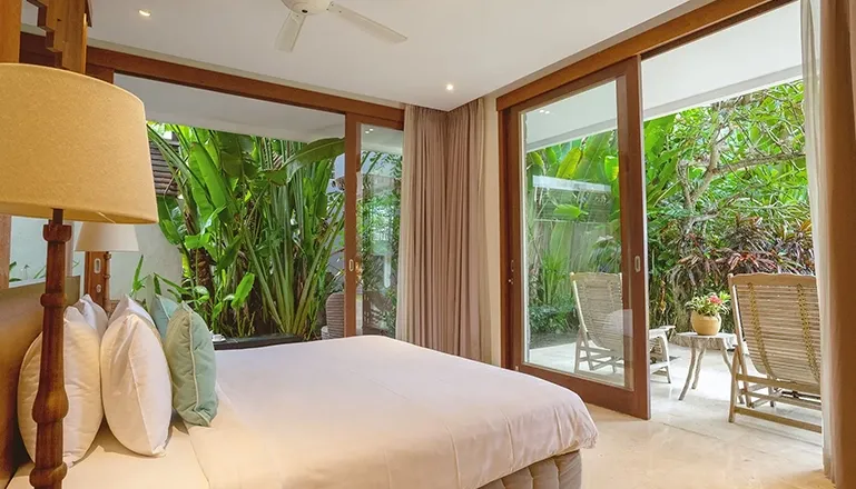 Beautiful bedroom with a minimalist aesthetic and a view at Omekai Cemagi