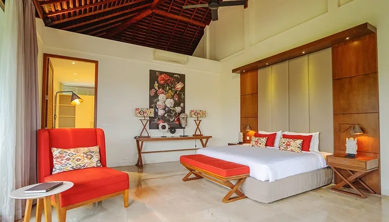 Elegant bedroom with a large bed and modern decor at Omekai Cemagi