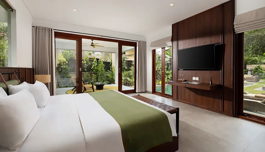 Modern master bedroom with king bed and garden views at Omekali