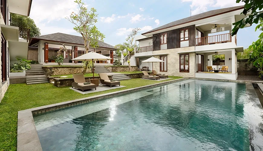Panoramic view of villa with large pool and interconnected buildings at Omekali