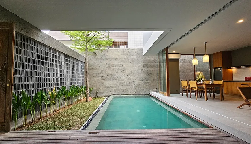 Tranquil courtyard with plunge pool beside spacious lounge at Pulang Villas