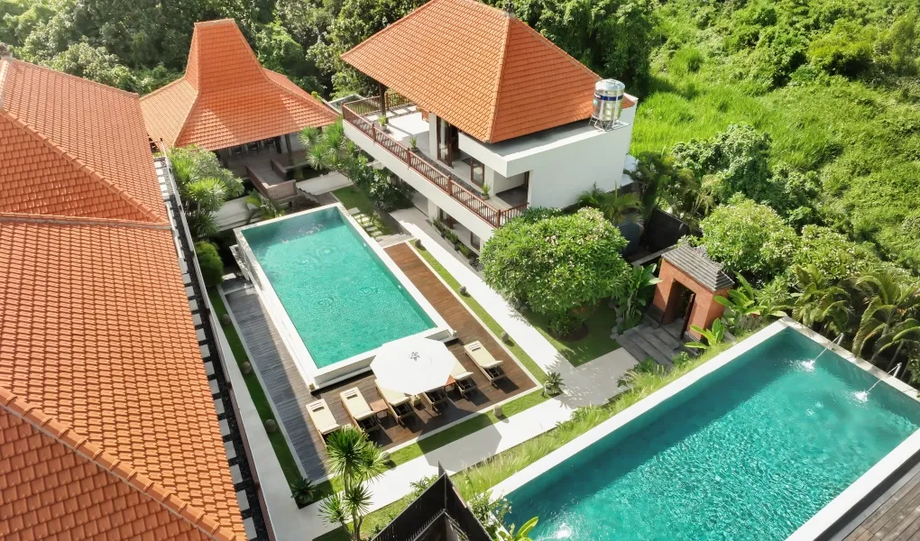 Aerial view of a large villa with two swimming pools at The Bija Villas