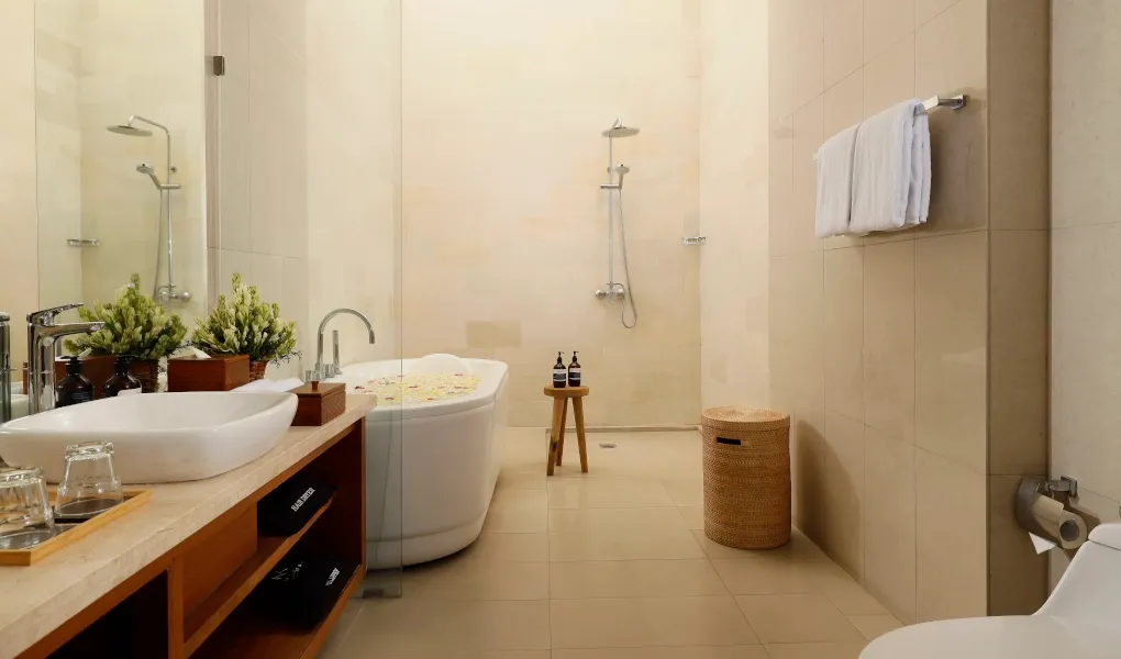 Elegant bathroom with a soaking tub and double vanity at The Bija Villas
