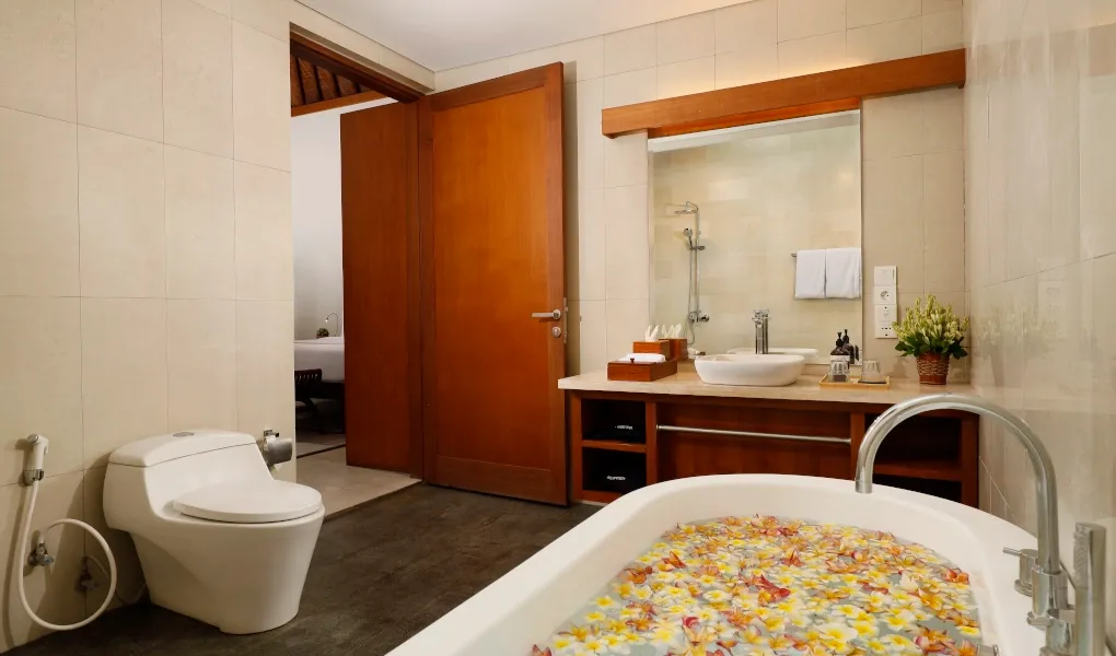 Elegant bathroom featuring a deep soaking tub and walk-in shower at The Bija Villas