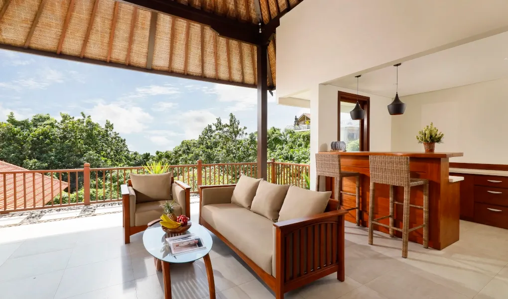 Open-air lounge with a bar and expansive views at The Bija Villas