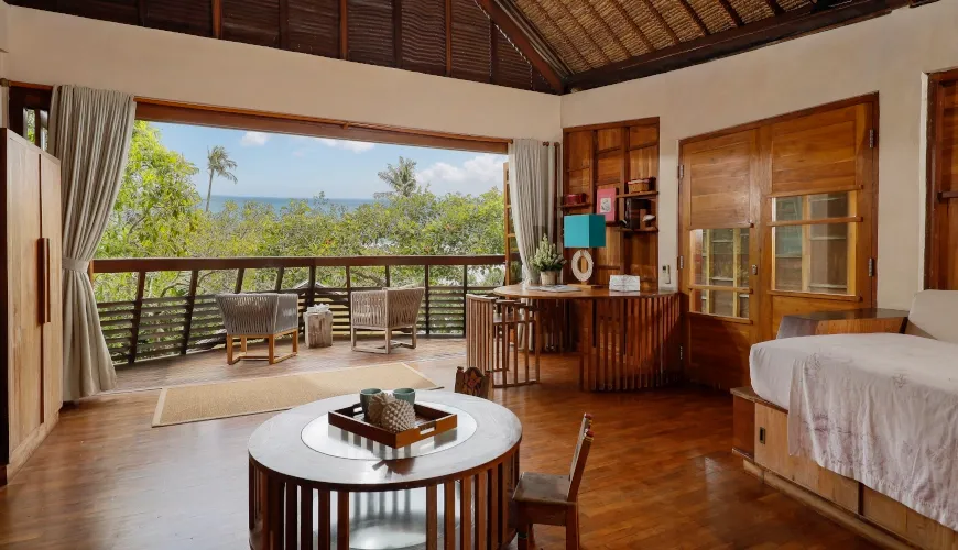 the-cove-bali-villa-warm-wooden-media-room-with-cozy-daybeds-and-rustic-furniture-tabanan
