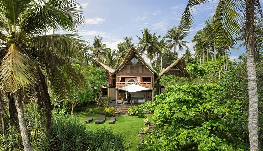 Lush tropical setting features luxurious villas and dense surrounding greenery at The Cove Bali