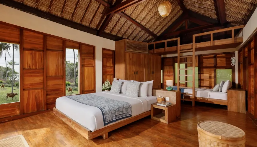 Luxury Balinese family suite with king bed and bunk beds at The Cove Bali