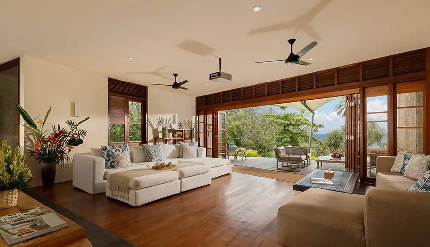 Spacious living area features open design and stunning outdoor ocean vista at The Cove Bali