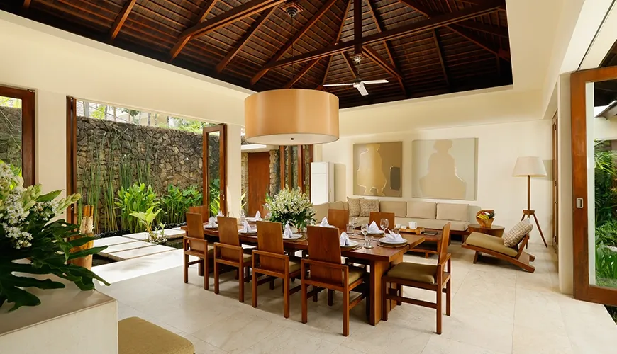 Spacious open plan living dining area with lush garden views at The Suar Seminyak