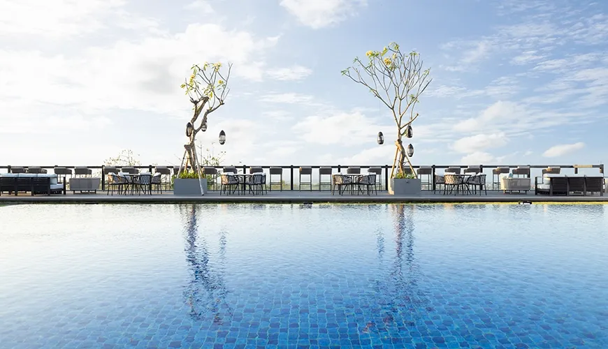 Bali infinity pool with inviting lounge area at The Tulou