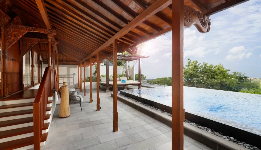 Luxury villa with infinity pool and traditional Balinese architecture at The Tulou Bali Villa