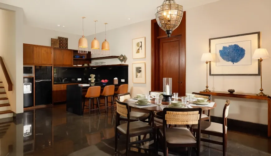 Dining and kitchen interior with wooden furniture and modern decor at The Tulou Bali Villa