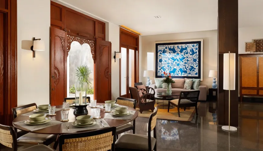 Dining area with a round table and chairs at The Tulou Bali Villa