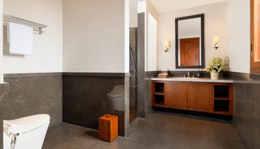Modern bathroom with a vanity and a walk-in shower at The Tulou Bali Villa