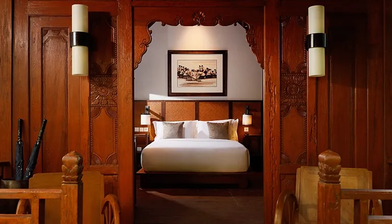 Beautiful Bali bedroom with handcrafted details at The Tulou
