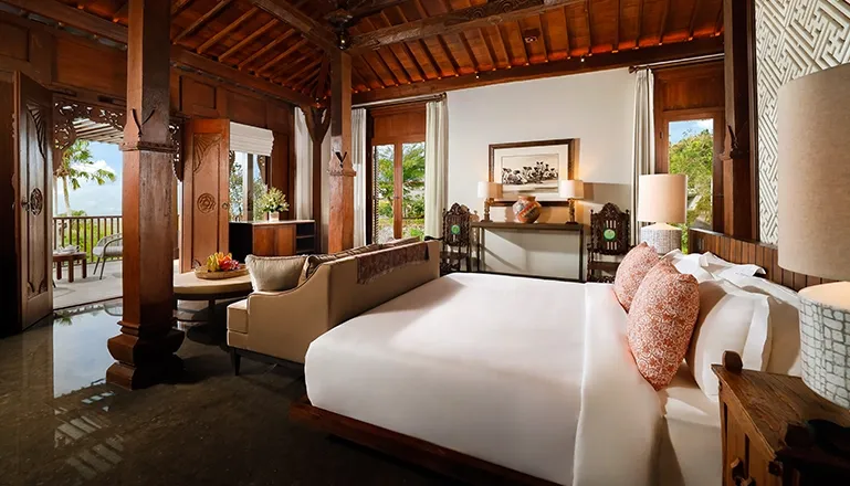 Beautiful Bali bedroom with handcrafted details at The Tulou