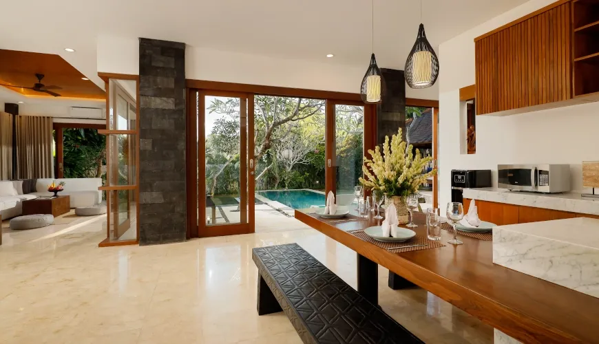 Modern luxury villa dining area with pool view at Villa Sophie