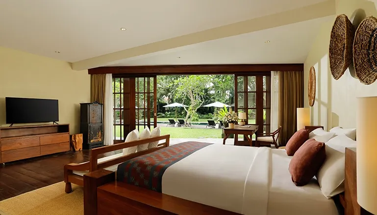 Beautiful bedroom with a minimalist aesthetic and a view at Tirtadari Villa
