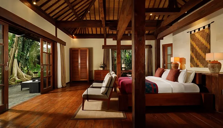 Inviting bedroom with warm ambiance and a relaxing atmosphere at Tirtadari Villa