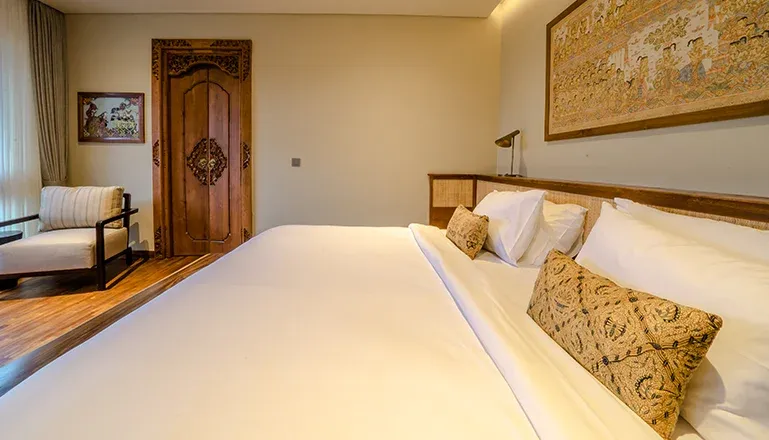 Luxurious master bedroom with pool and garden views at Uma Berawa Villa