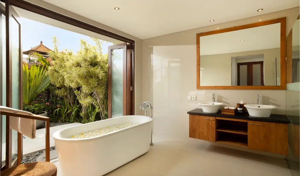 Luxurious bathroom with a soaking tub and an open-air feel at VIlla Ambara