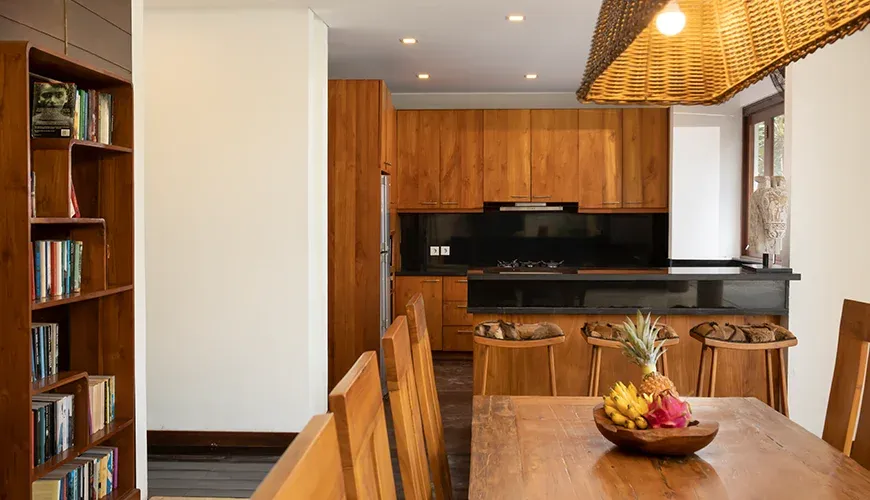 Natural wood kitchen and dining space in a luxurious villa at Villa Ambara