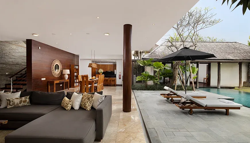 Open-air Bali living area overlooking the swimming pool at Villa Ambara