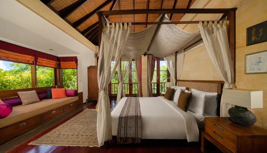 Master Bedroom Suite with King Canopy Bed and Garden View at Villa Ambiente
