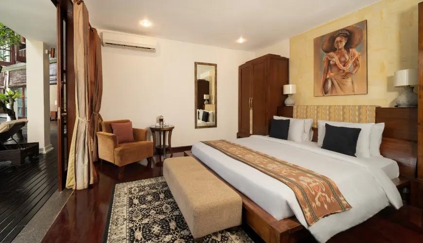 Deluxe King Bedroom with Elegant Balinese Interior at Villa Ambiente