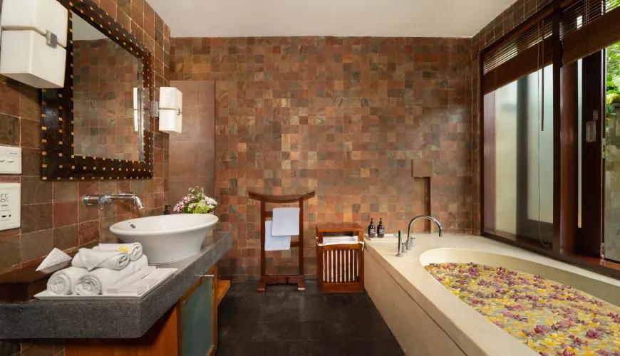 Luxury Natural Stone Bathroom with Double Vanity at Villa Ambiente