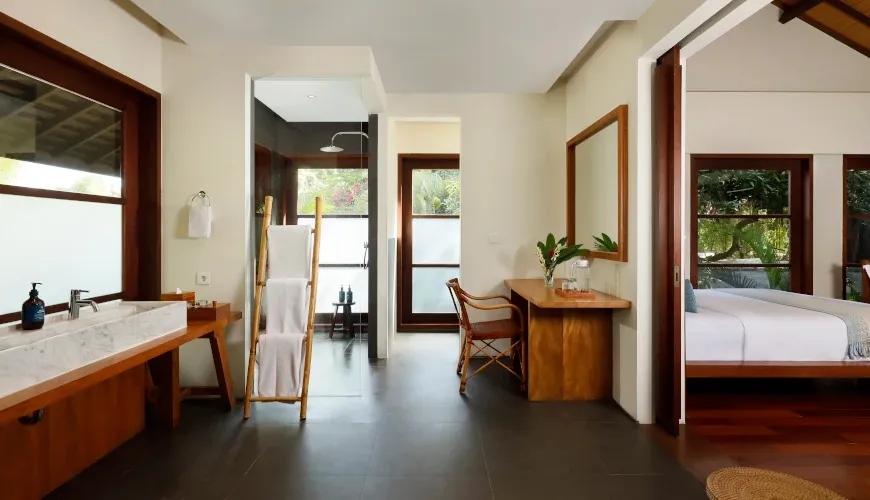 Luxury villa bathroom with dual sinks and open-air shower at Villa Amita