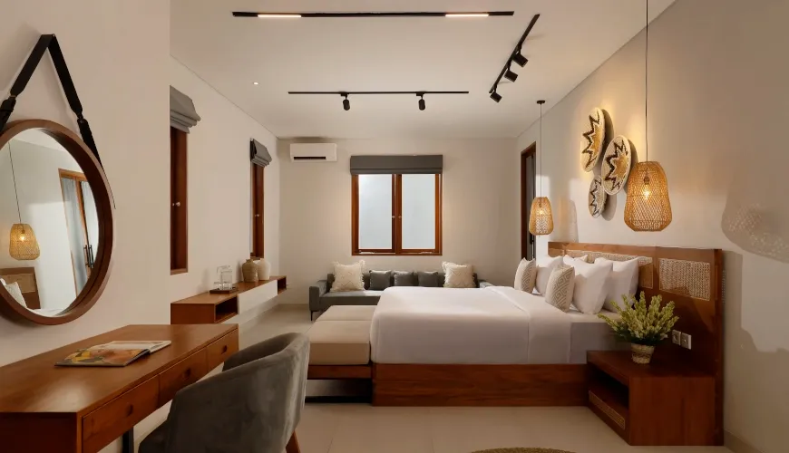 Bright bedroom with modern Bali decor and wooden furnishings at Villa Ananya