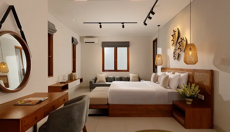 Comfortable bedroom with king bed desk and stylish decor at Villa Ananya