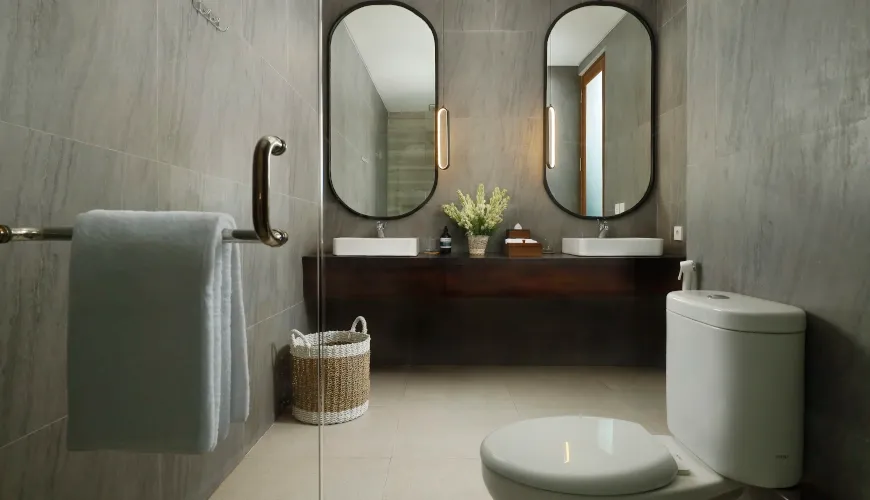 Modern, clean master bathroom with double sinks and contemporary mirrors at Villa Ananya