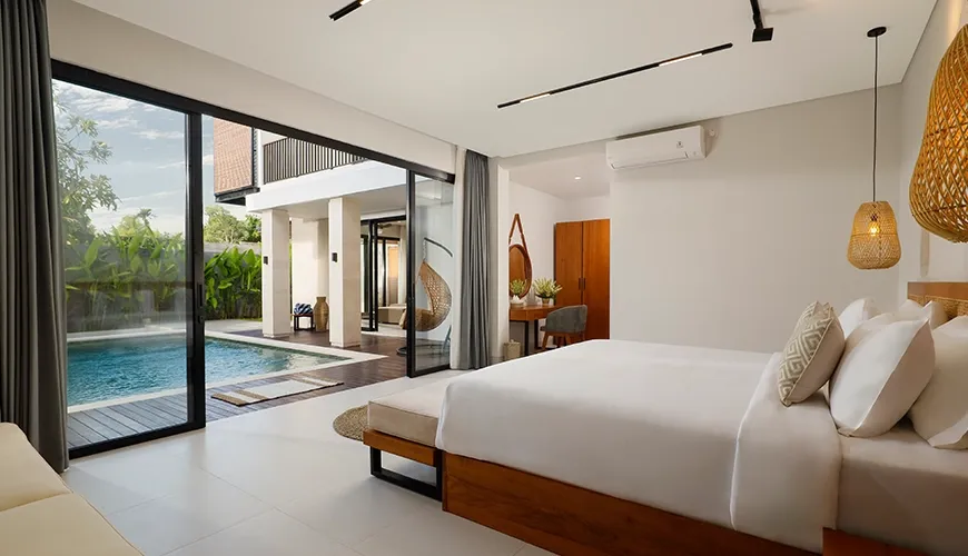 Spacious master bedroom with king bed opens to private pool at Villa Ananaya