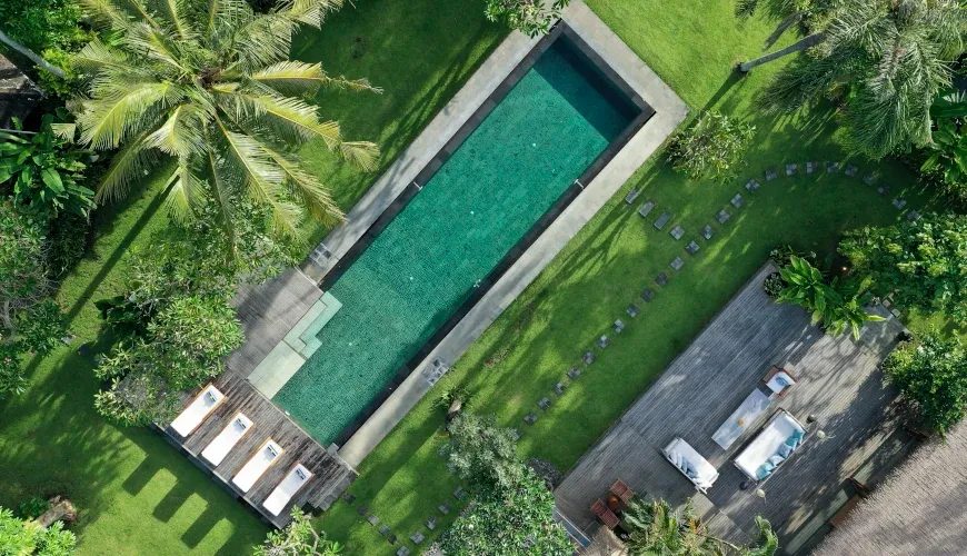 Aerial view of a rectangular pool with sun loungers at Villa Bangkuang