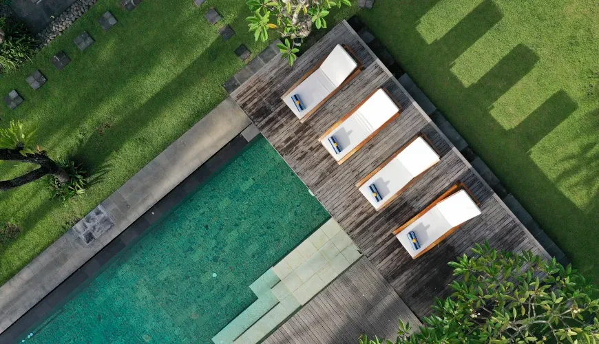 Aerial view of a villa pool and sun loungers at Villa Bangkuang