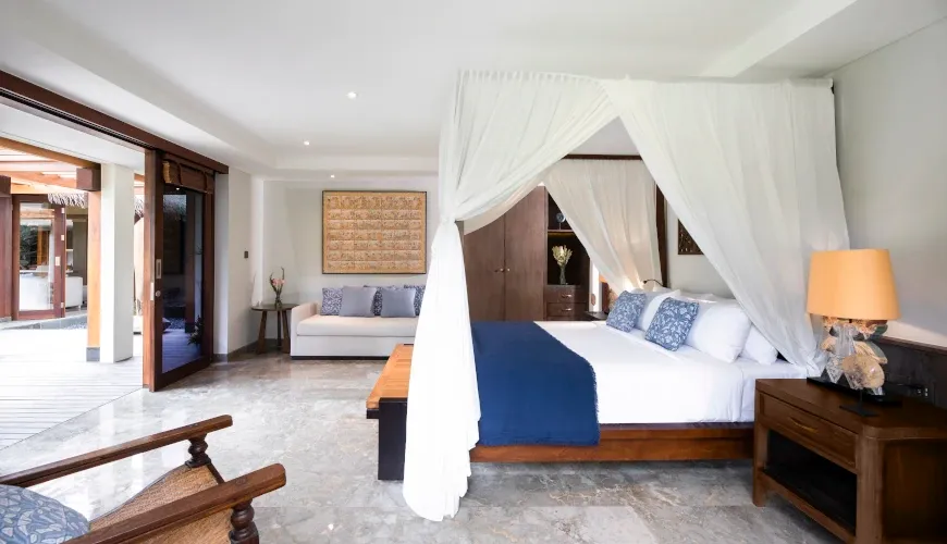 Bright bedroom with canopy bed and marble flooring at Villa Bangkuang